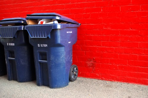 Front view of a skip in Elephant and Castle with recycling signage