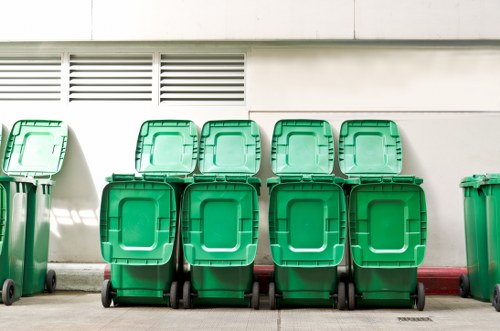 A professional skip being loaded with waste